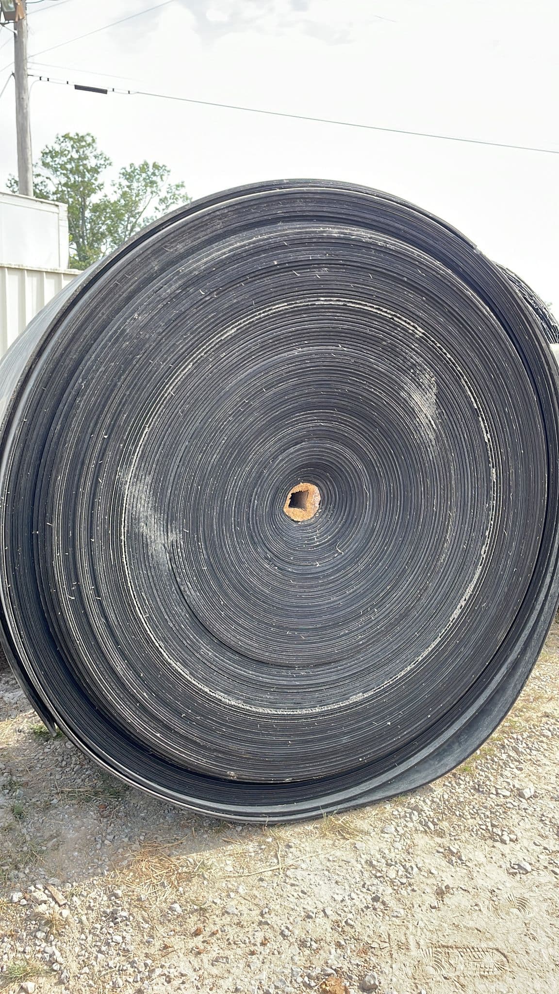 Rolled belts staged for transport